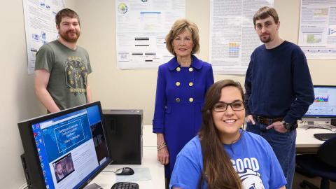 IC CAE Scholar Corinne Peacher, front, and research scientists Jason Toone, left, and Charles Collins, right, with Dr. Sara Graves, center, in the IC CAE laboratory. IC CAE Scholar Corinne Peacher, front, and research scientists Jason Toone, left, and Charles Collins, right, with Dr. Sara Graves, center, in the IC CAE laboratory.