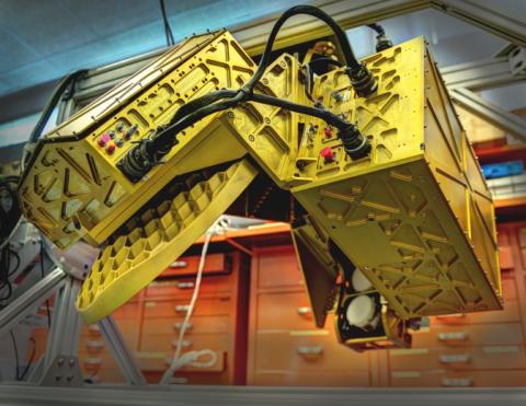 The HIWRAP dual frequency Doppler radar hung under the Global Hawk. On the left, the golden disc is the antenna and on the right, the two small white discs are the radar beam transmitters, one for each of two frequencies. The whole apparatus spins while flying. Image Credit: Bill Hrybyk / NASA